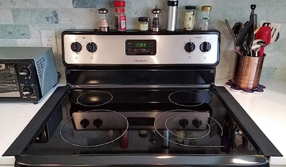 black stove gap covers covering the space between a stove and counters