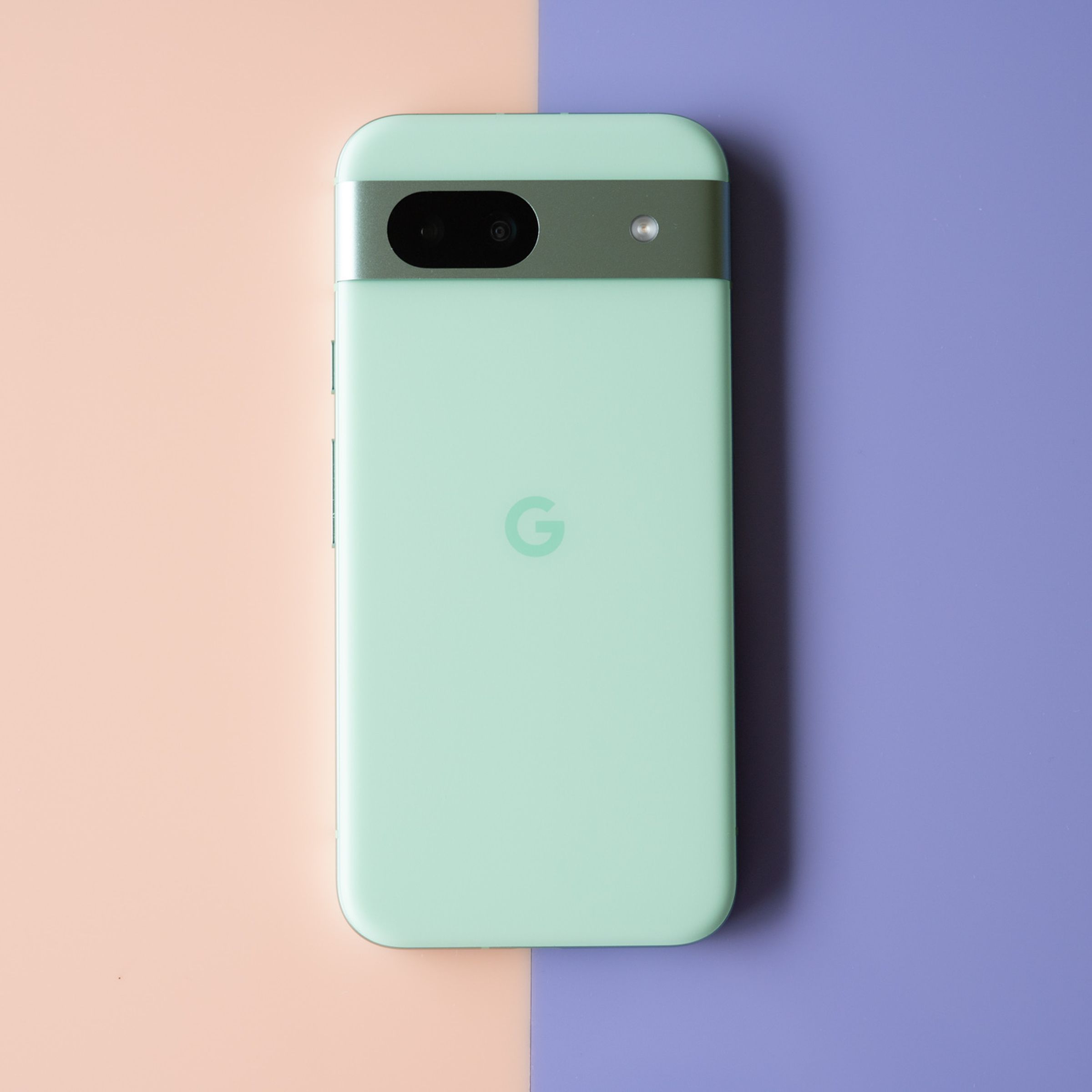 Google Pixel 8A in aloe green showing back panel.