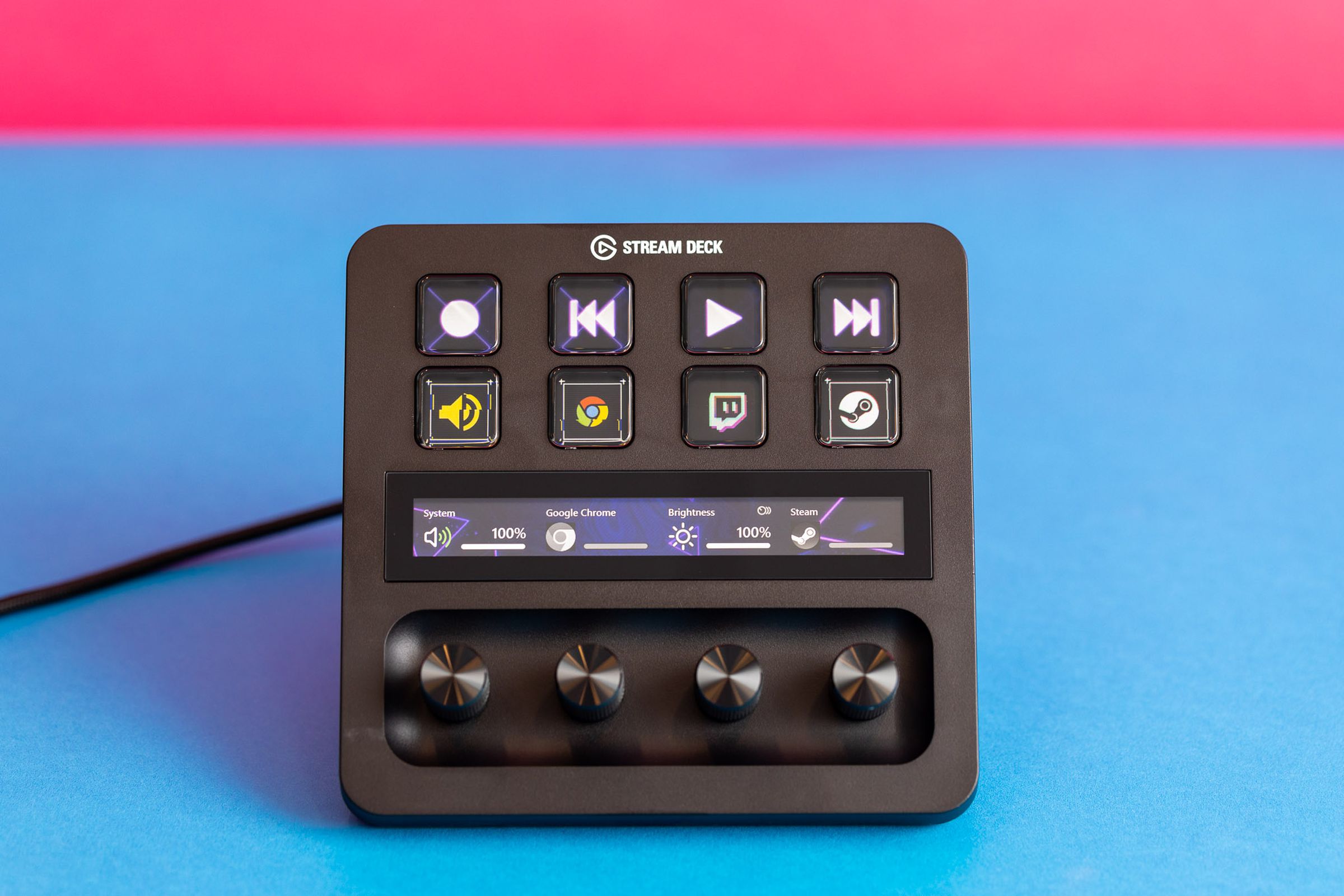 Elgato Stream Deck Plus pictured against colorful background