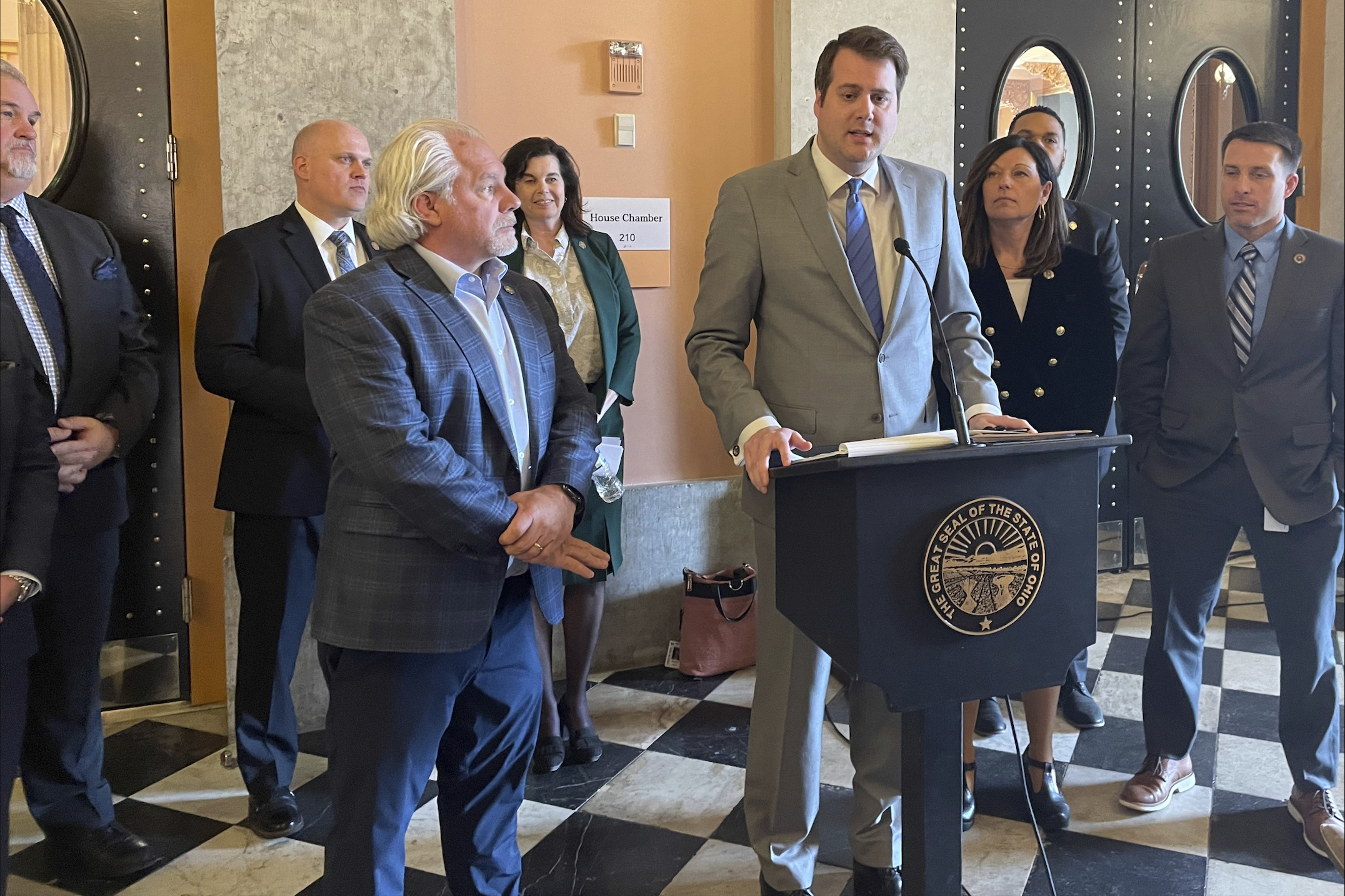 Ohio state Rep. Derek Merrin talks to reporters on Feb. 15, 2023, at the Ohio Statehouse in Columbus, Ohio, alongside his advocates about their own legislative priorities, separate from those laid out by elected House Speaker Jason Stephens earlier that day.