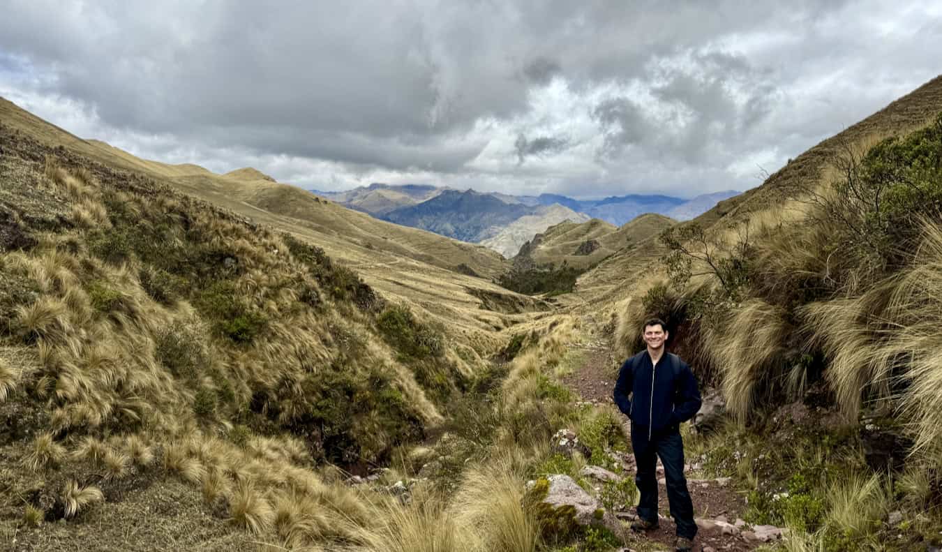 Nomadic Matt poses for a photo while hiking in the mountains of Peru