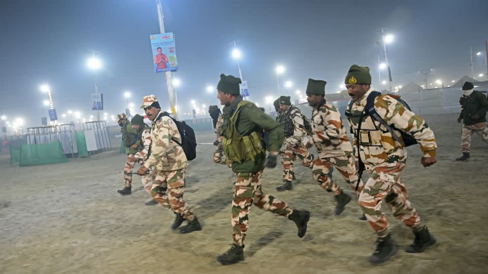 Security personnel at the crowd site crushed in Prayagraj. - Arun Sankar/AFP/Getty Images