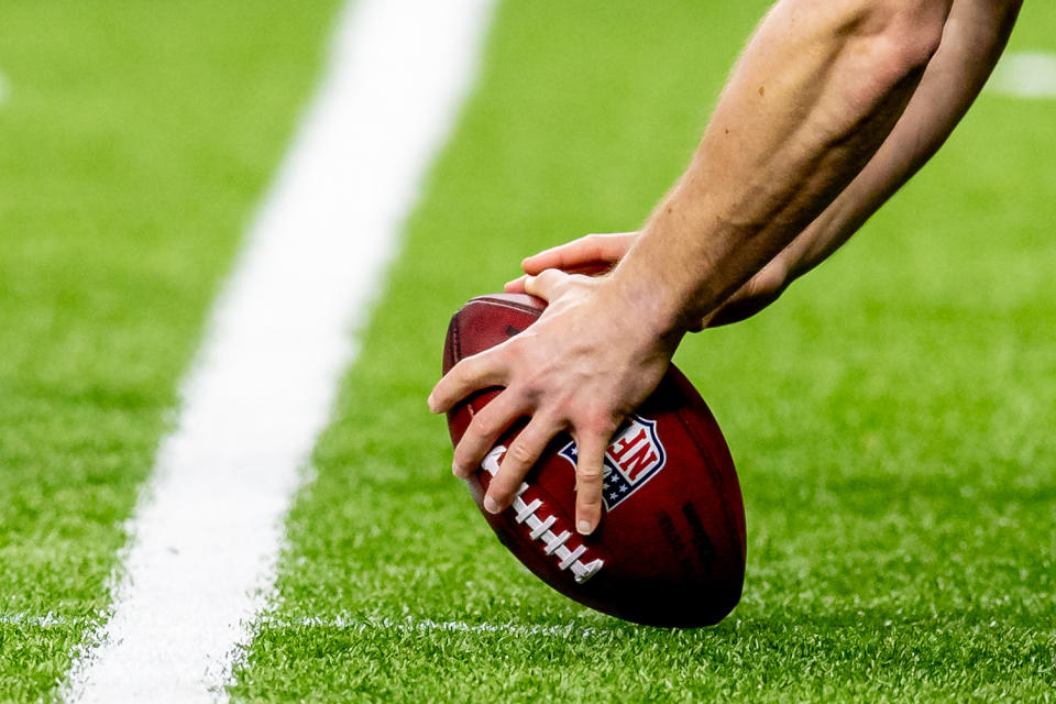 Dec 29, 2024; New Orleans, Louisiana, USA; Detailed view of the NFL football being hiked during the second half of the game between the New Orleans Saints and the Las Vegas Raiders at Caesars Superdome. Mandatory Credit: Stephen Lew-Imagn Images