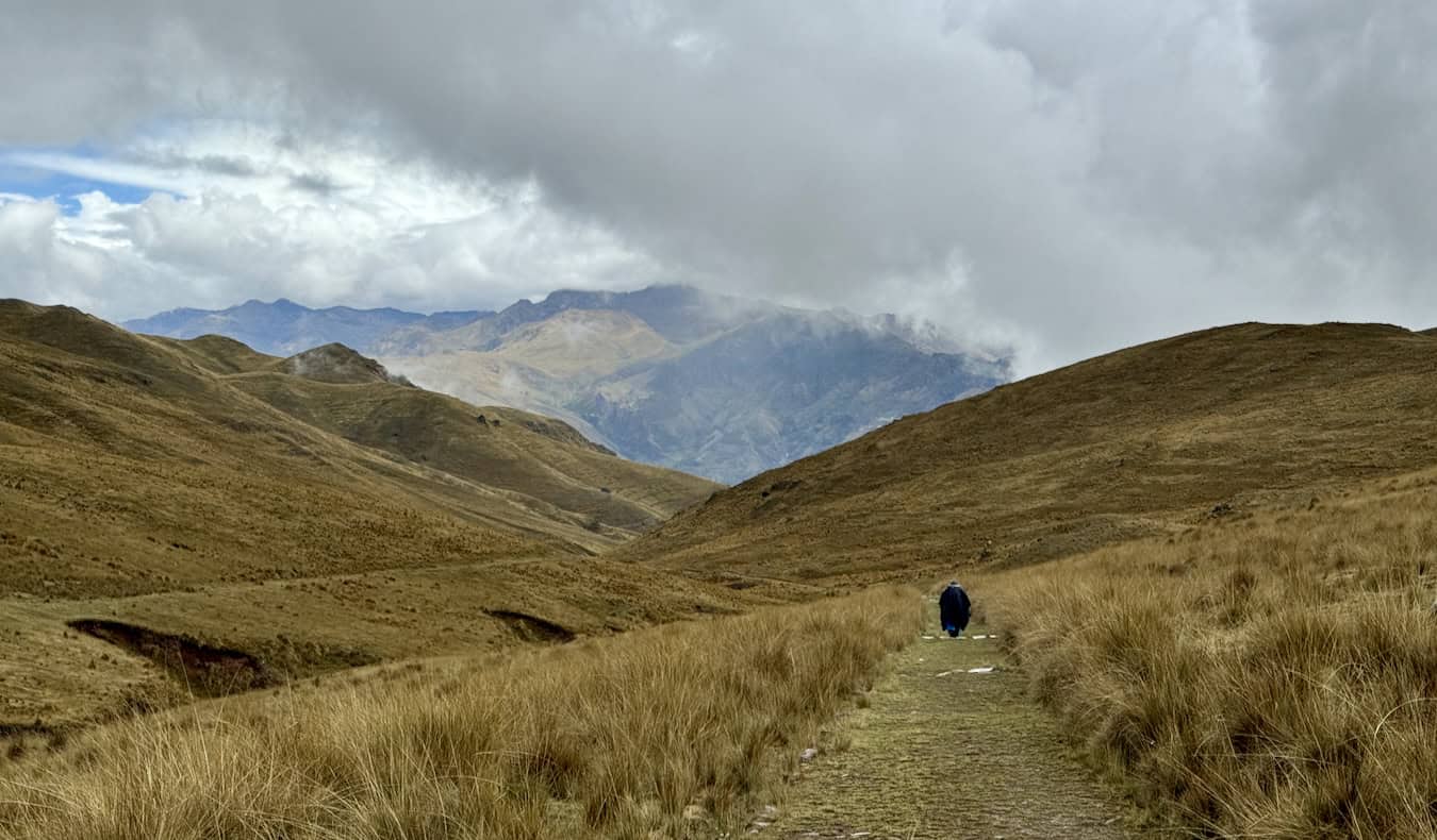 An old woman walking long distances in the Sacred Valley of Peru