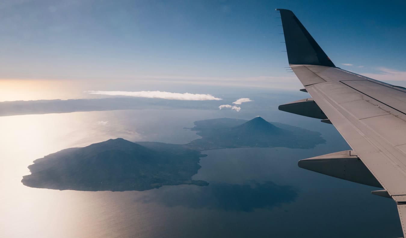 A journey takes off against a blue sky in Central America