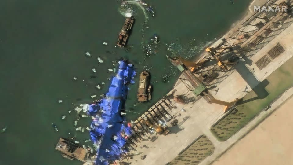 Maxar photos show the ongoing efforts to hide damaged destroyer in the Hambuk shipyard after one day of the failed launch. - Maxar/Digitalglobe/Getty Images