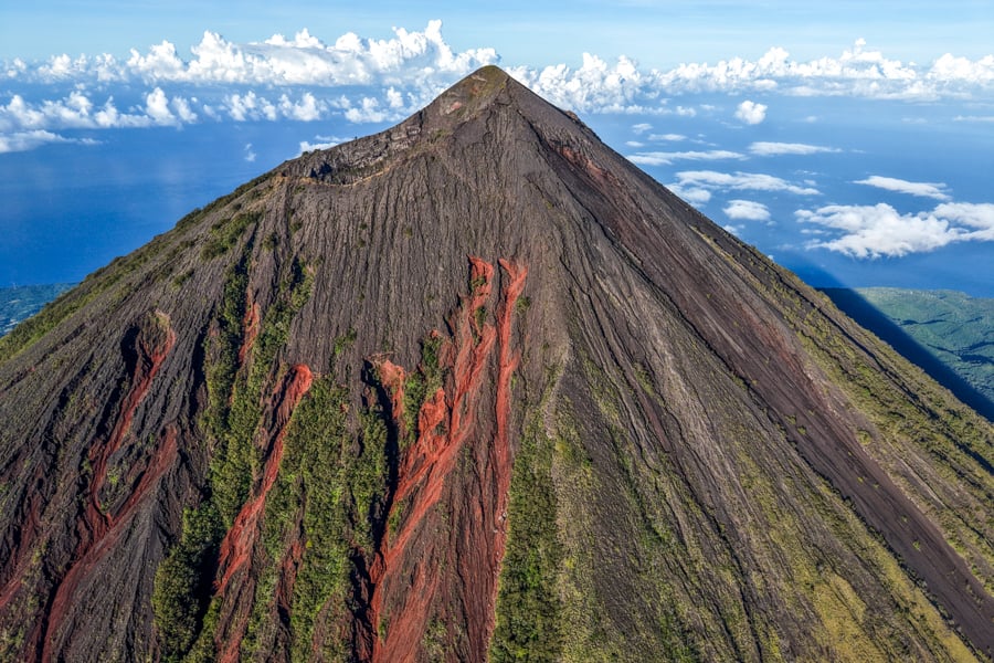 Volcano Drone View with red rocks on the foothills of the mountain