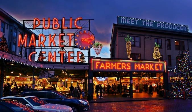 Neon Public Market sign lit up at night in Seattle, Washington