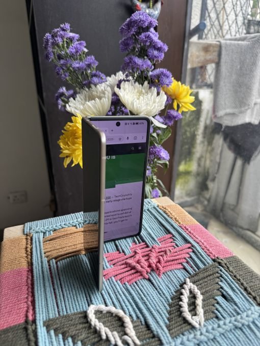 Image shows Honor Magic V5 half with Techcrunch Open.