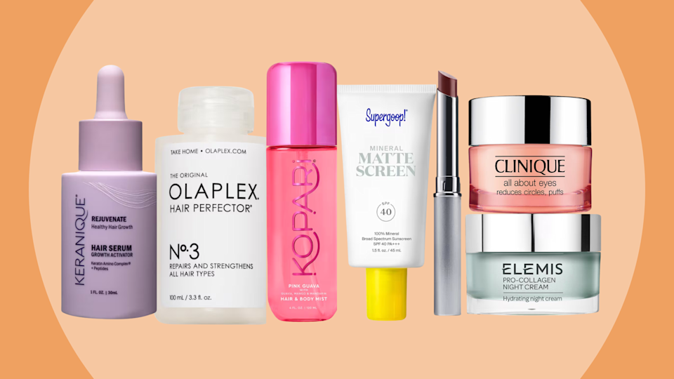 Makeup products on an orange background