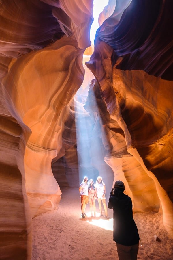 Tourists take photos in the sunshine in the Upper Antelope Valley