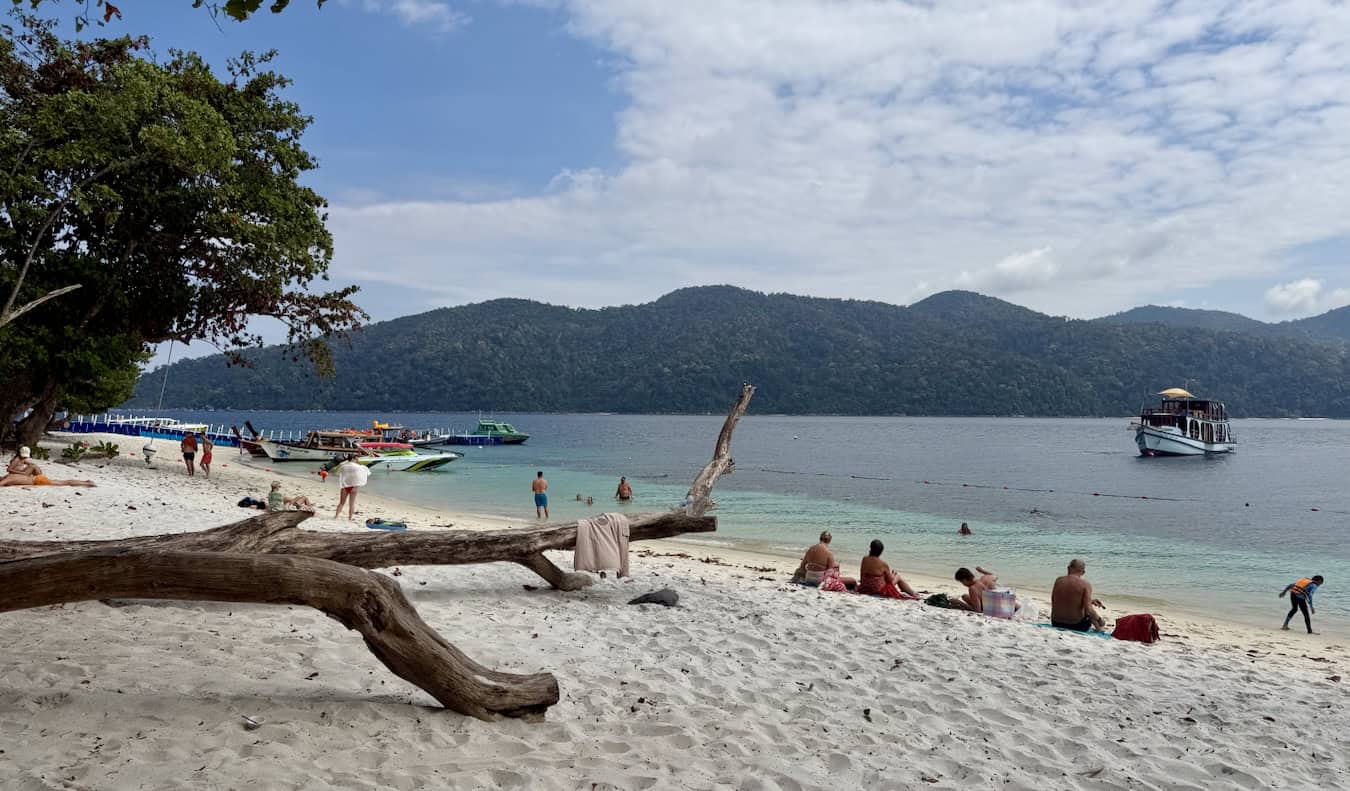Tourist and boats in Ko Rawi, Thailand on the beach