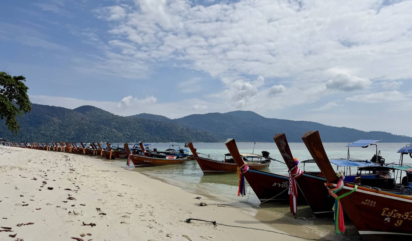 Lots of long-tail boats line the beaches near Ko Lipe Island in Thailand
