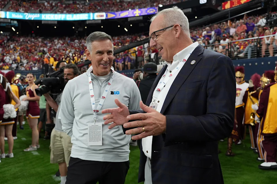 Sep 1, 2024; Paradise, Nevada, USA; Big 10 commissioner Tony Petitti (left) and SEC commissioner Greg Sankey attend the game between the LSU Tigers and the Southern California Trojans at Allegiant Stadium. Mandatory Credit: Kirby Lee-USA TODAY Sports