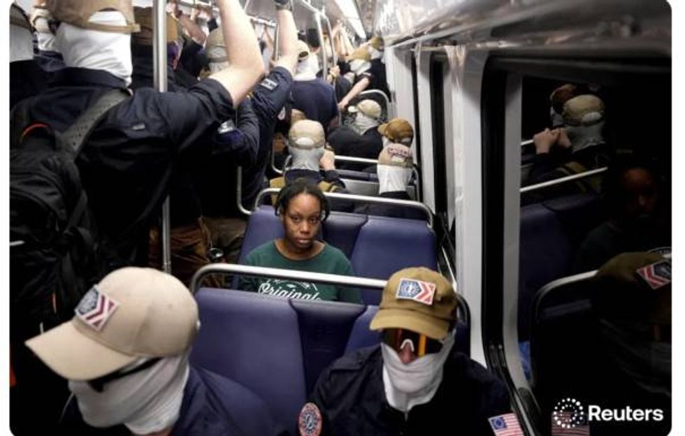 A lonely, nervous black woman rides the D.C. subway surrounded by masked Nazis in a car "An image that refers to an era."