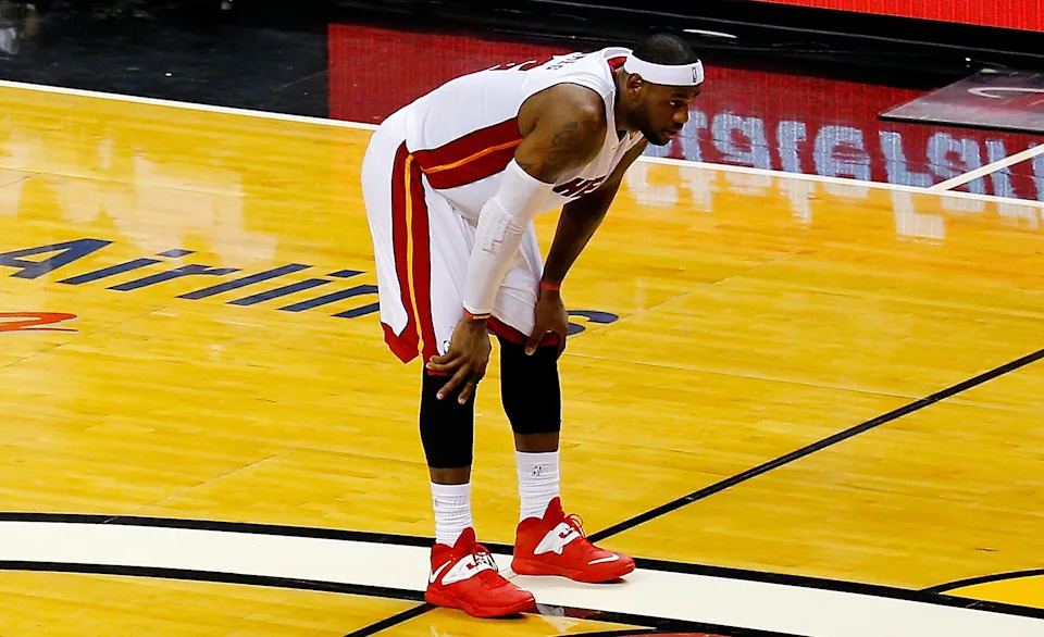 MIAMI, FL - JUNE 12:  LeBron James #6 of the Miami Heat looks on against the San Antonio Spurs during Game Four of the 2014 NBA Finals at American Airlines Arena on June 12, 2014 in Miami, Florida. NOTE TO USER: User expressly acknowledges and agrees that, by downloading and or using this photograph, User is consenting to the terms and conditions of the Getty Images License Agreement.  (Photo by Chris Trotman/Getty Images)
