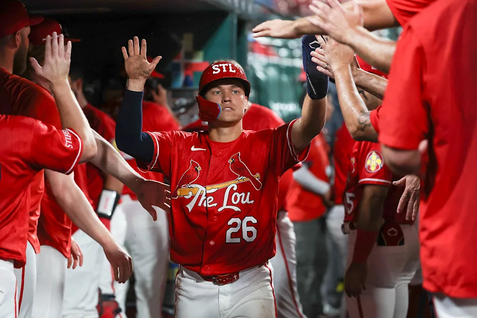 St. Louis Cardinals' JJ Wetherholt is congratulated by teammates after scoring a run during the sixth inning of a baseball game against the Atlanta Braves Friday, July 10, 2026, in St. Louis. (AP Photo/Scott Kane)