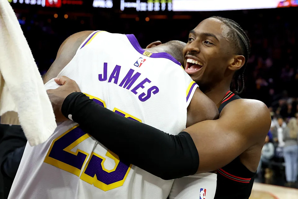 PHILADELPHIA, PENNSYLVANIA - DECEMBER 07: Tyrese Maxey #0 of the Philadelphia 76ers hugs Lebron James #23 of the Los Angeles Lakers after a game at Xfinity Mobile Arena on December 07, 2025 in Philadelphia, Pennsylvania. The Los Angeles Lakers won 112-108. NOTE TO USER: User expressly acknowledges and agrees that, by downloading and or using this photograph, User is consenting to the terms and conditions of the Getty Images License Agreement. (Photo by Emilee Chinn/Getty Images)