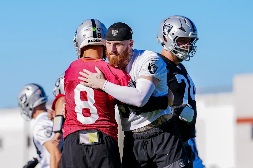 HENDERSON, NEVADA - JUNE 09: Maxx Crosby #98 and Kirk Cousins #8 of the Las Vegas Raiders embrace during mandatory minicamp at the Las Vegas Raiders Headquarters/Intermountain Health Performance Center on June 09, 2026 in Henderson, Nevada. (Photo by Louis Grasse/Getty Images)