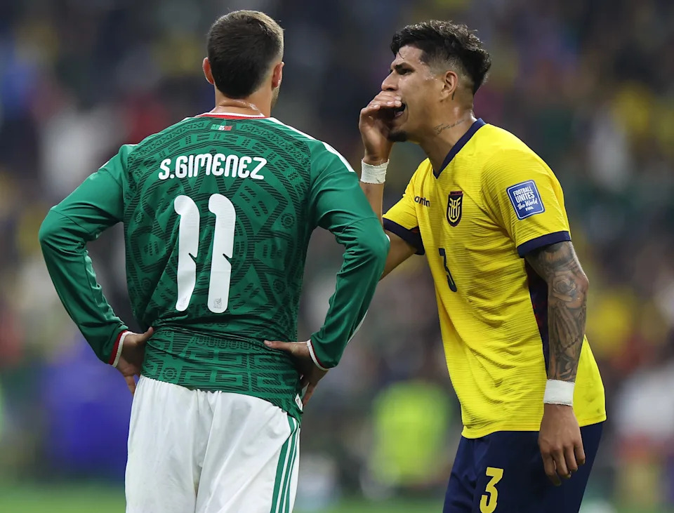 Ecuador's Piero Hincapie covers his mouth, talking to Mexico's Santiago Gimenez, then he is sent off with a red card during the round of 32 match between Mexico and Ecuador. (Photo by Francisco Canedo/Xinhua via Getty Images)
