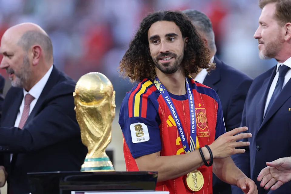 EAST RUTHERFORD, NEW JERSEY - JULY 19: Marc Cucurella of Spain looks at the World Cup trophy after the FIFA World Cup 2026 Final match between Spain and Argentina. (Photo by Catherine Ivill - AMA/Getty Images)