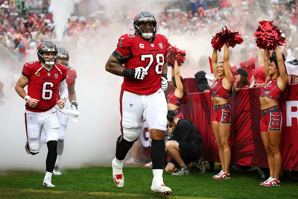TAMPA, FLORIDA - JANUARY 3: Baker Mayfield #6 and Tristan Wirfs #78 of the Tampa Bay Buccaneers run onto the field prior to an NFL football game against the Carolina Panthers at Raymond James Stadium on January 3, 2026 in Tampa, Florida. (Photo by Kevin Sabitus/Getty Images)