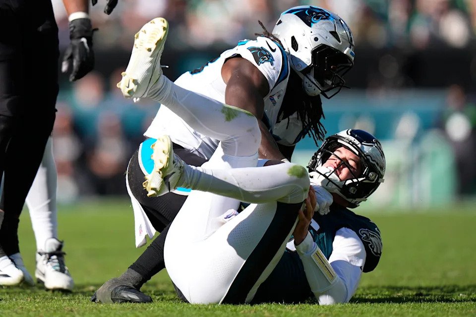 Carolina Panthers linebacker Devin Lloyd sacks Philadelphia Eagles quarterback Tanner McKee during the second half of an NFL football game in Philadelphia, Sunday, Oct. 18, 2026. (AP Photo/Chris Szagola)